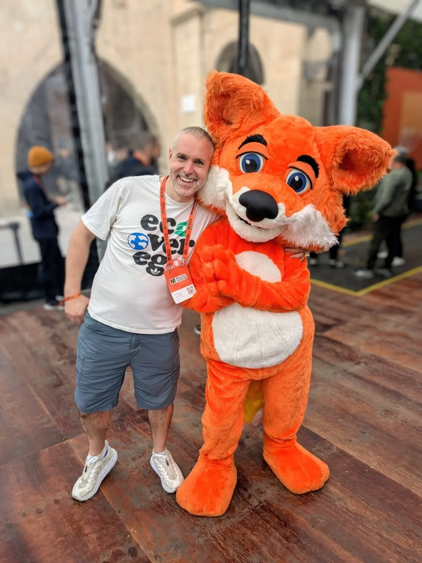 Doug hugging Fuzzy, the MozFest mascot