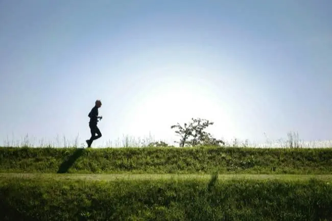 Someone running outside from a distance