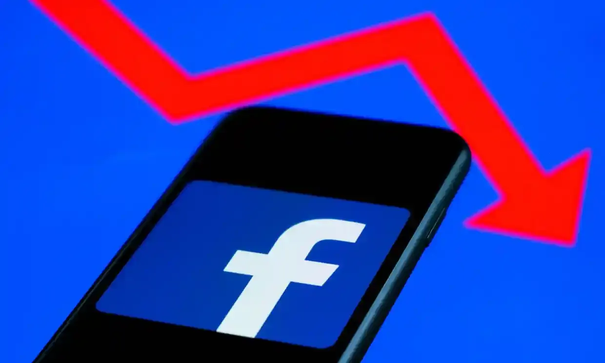 Facebook logo and stock ticker going down