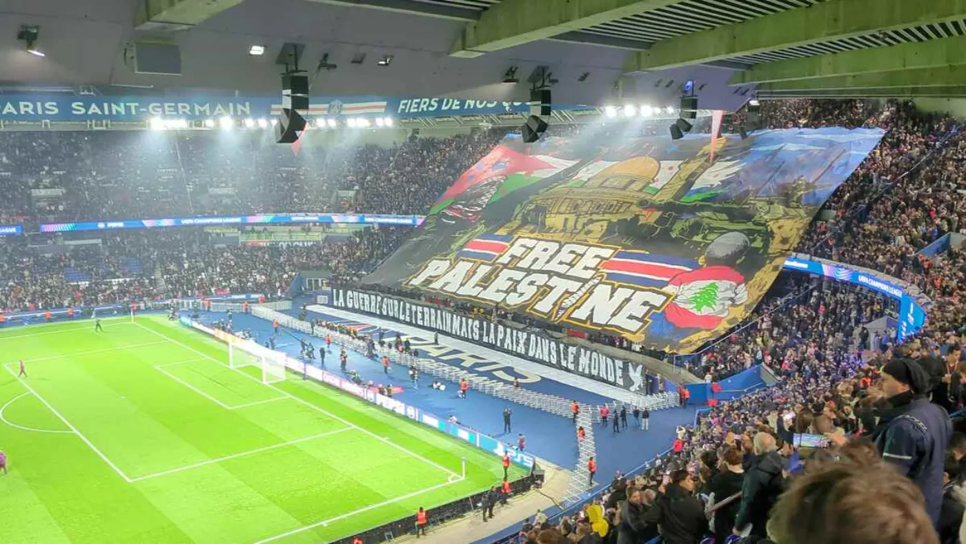 Huge banner reading 'Free Palestine' in the Parc des Princes