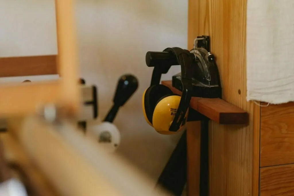 Noise cancelling headphones hanging on a hook