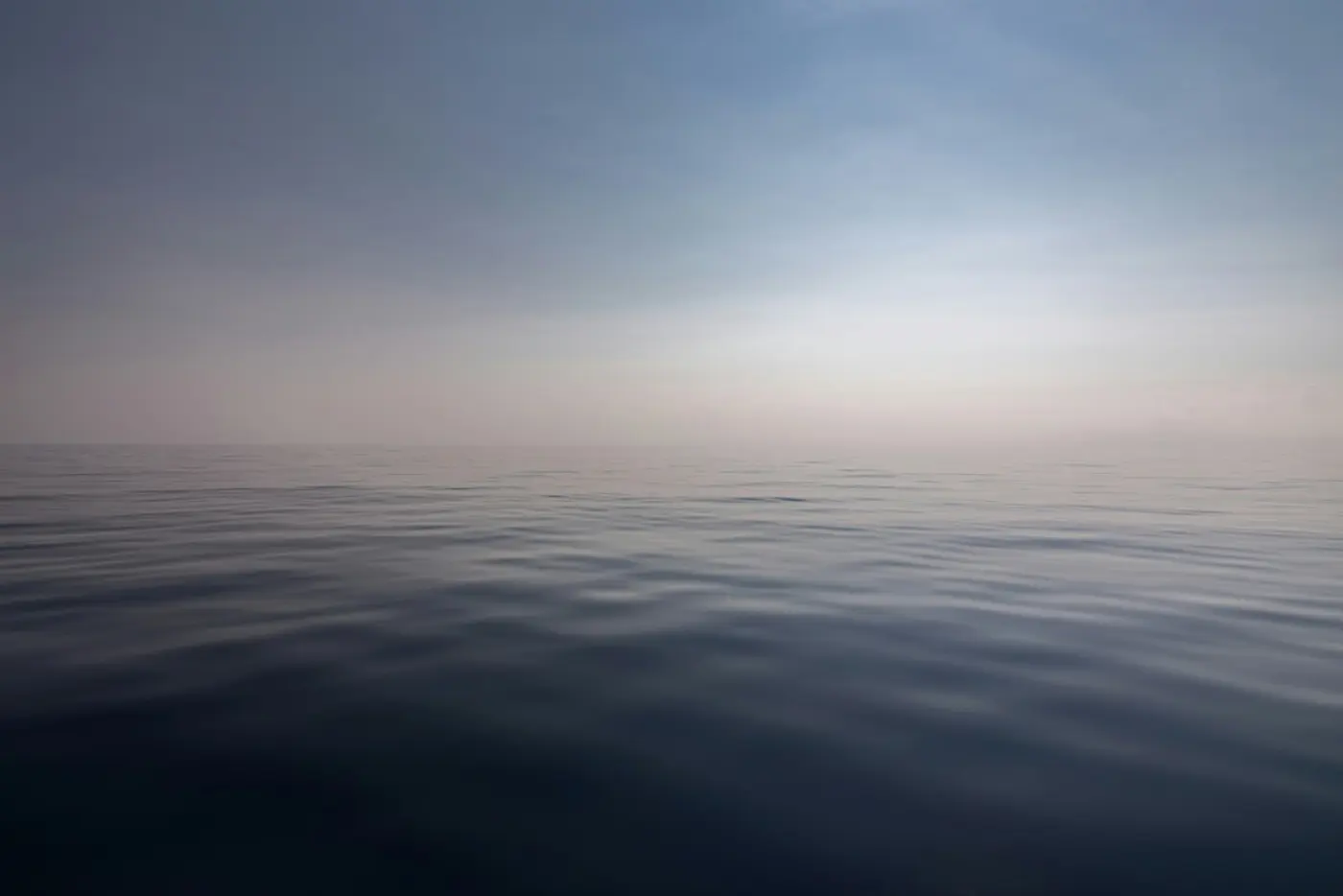 A photograph of the vast, seemingly endless ocean, and sky.