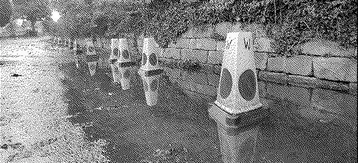 Traffic cones in a large puddle