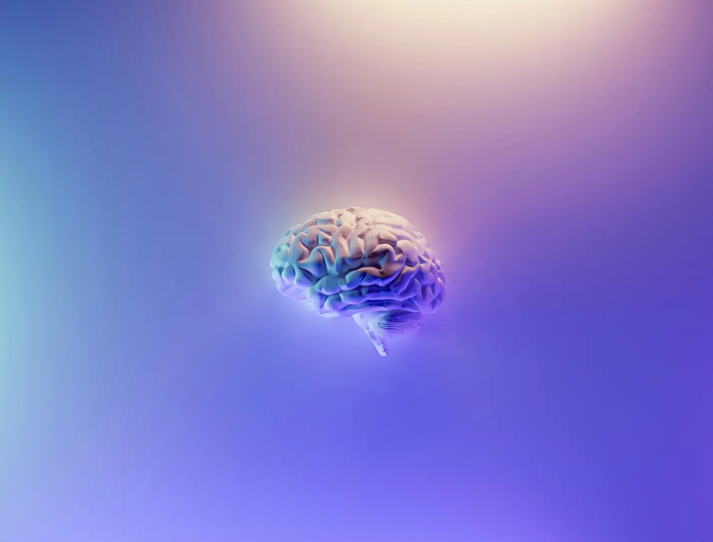 A brain depicted floating against a colourful, abstract background with gradients of purple and blue.