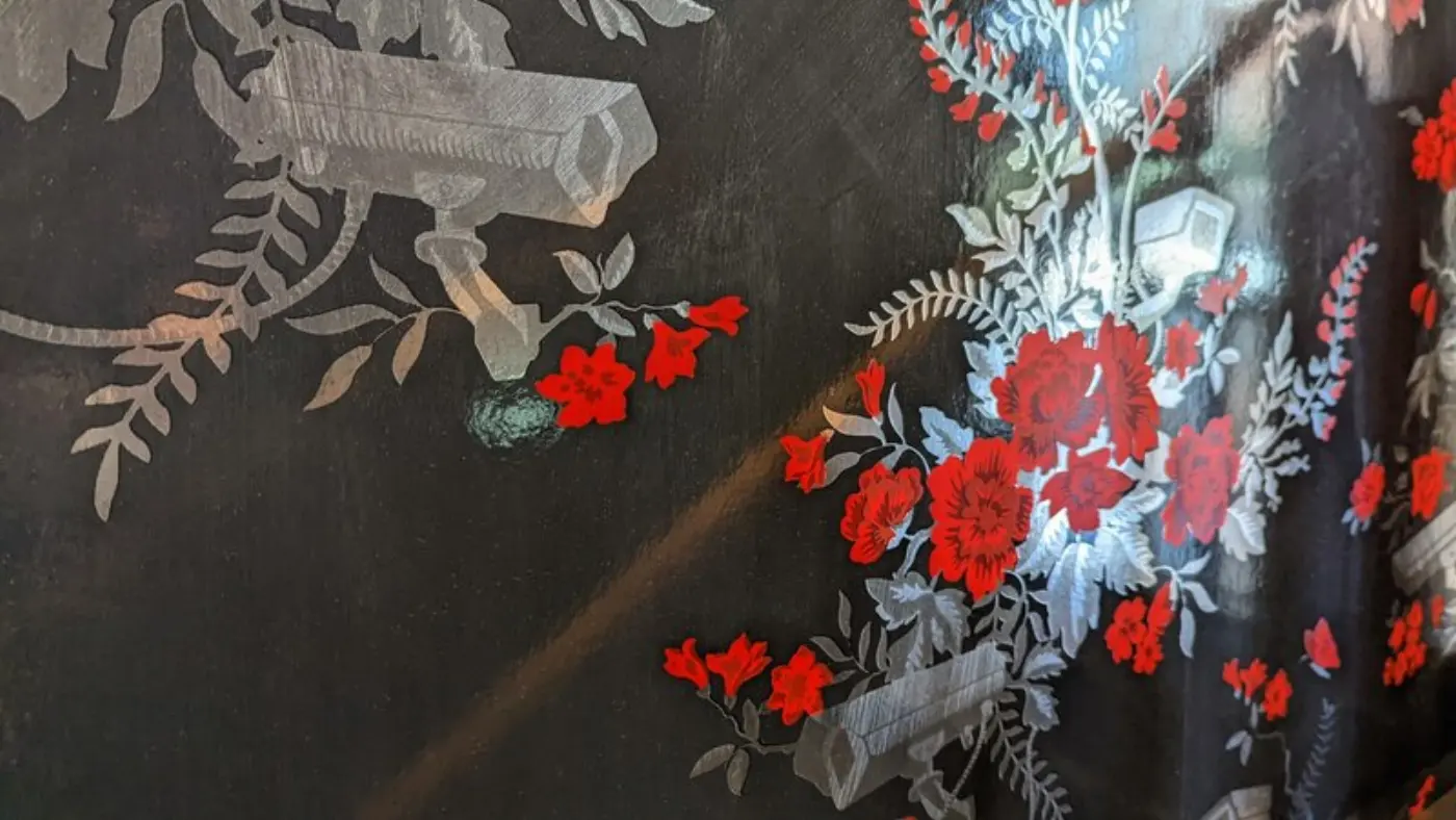 Hotel wallpaper featuring flowers and CCTV cameras