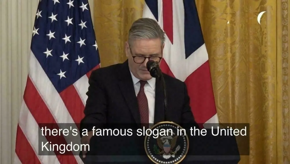 Keir Starmer with subtitles saying 'there a famous slogan in the United Kingdom'.