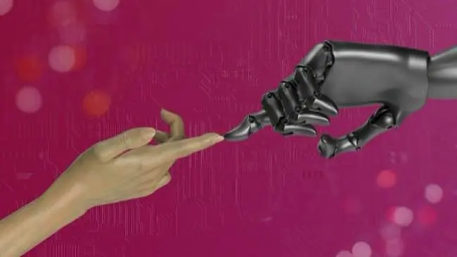 A robotic hand and a human hand are reaching towards each other against a pink background.