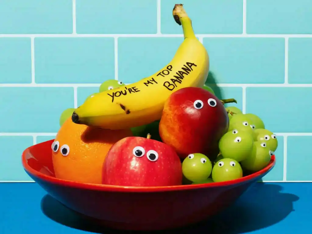 Bowl of fruit with stick-on eyes.