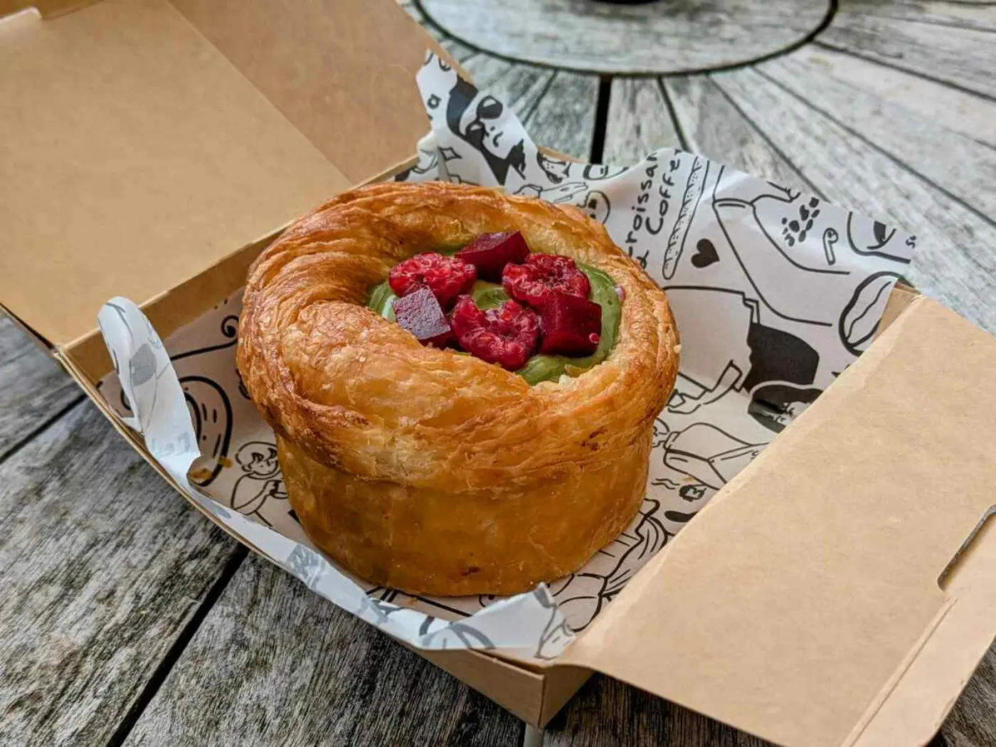 A pastry in a cardboard box